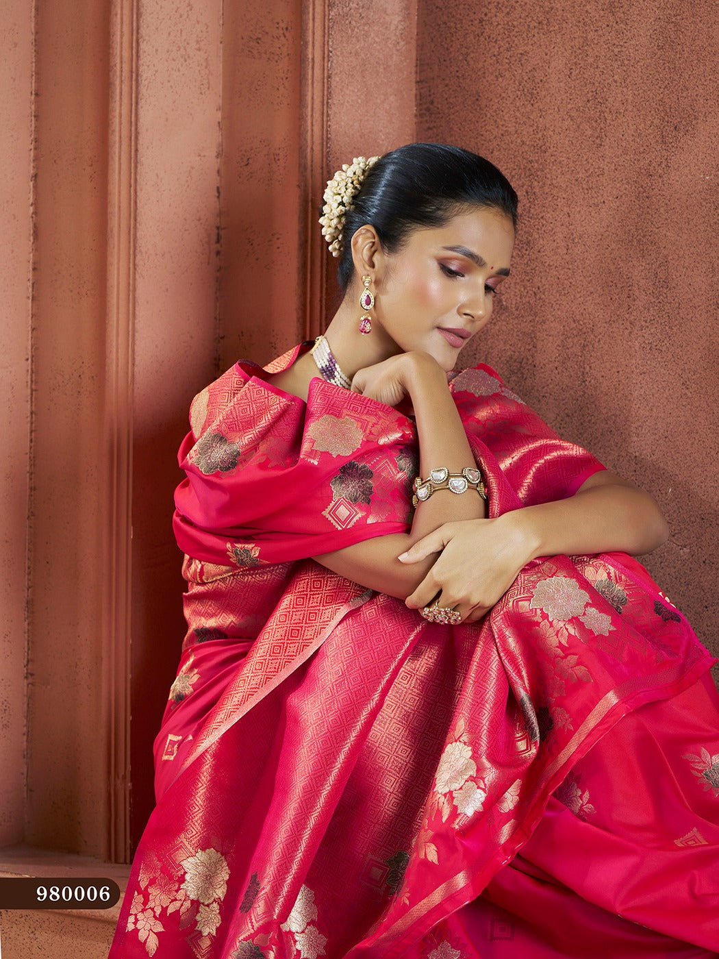 Elegant red Banarasi saree with delicate gold thread work, perfect for festive occasions