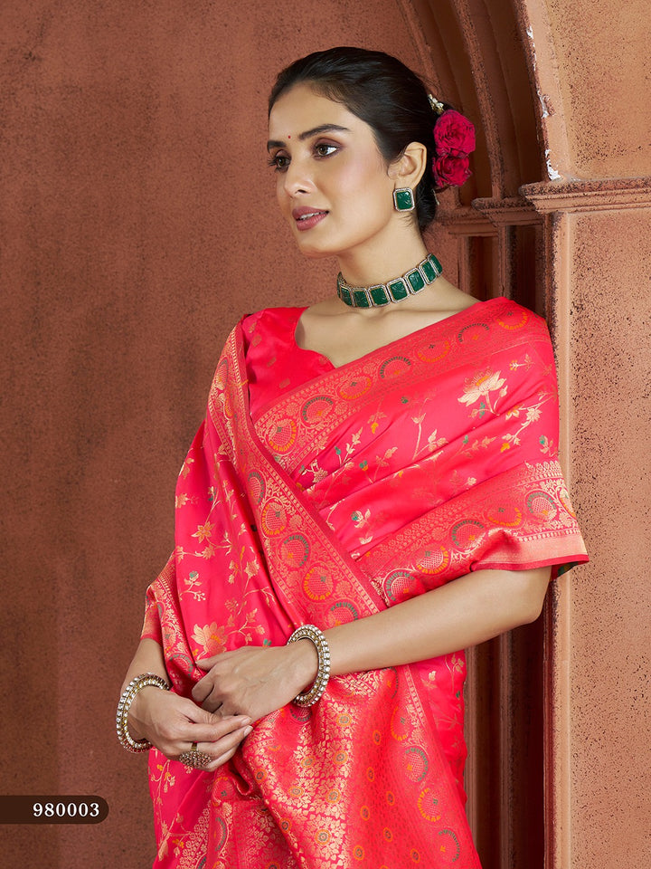 Gorgeous bright-pink Banarasi saree with traditional motifs, perfect for weddings.