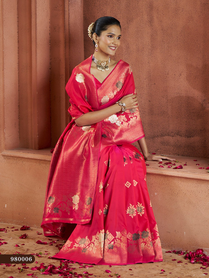 Stunning red Banarasi saree with gold zari work, perfect for wedding celebrations.