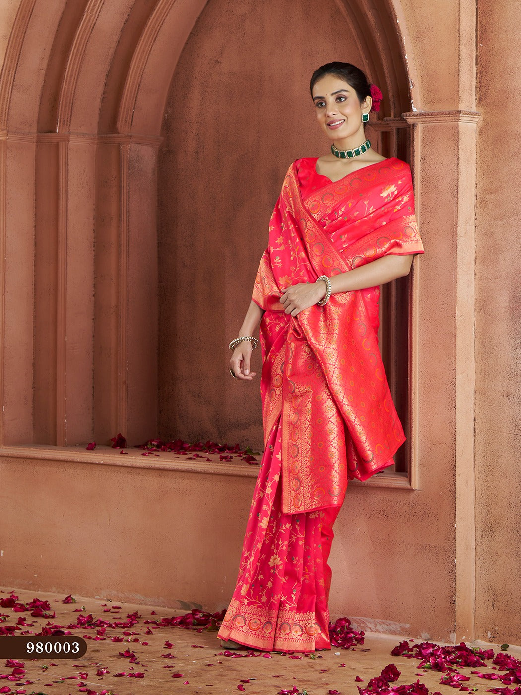 Stunning bright-pink Banarasi saree with rich gold zari work and silk blouse.