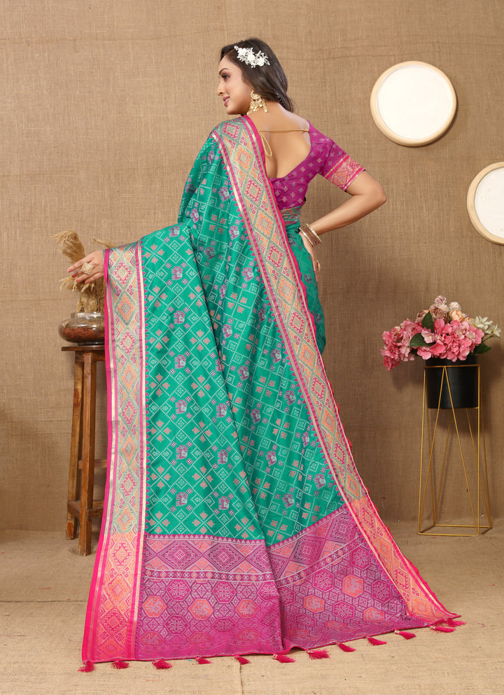 Classic sea blue Patola silk sari with luxurious zari pallu, ideal for traditional Indian occasions.