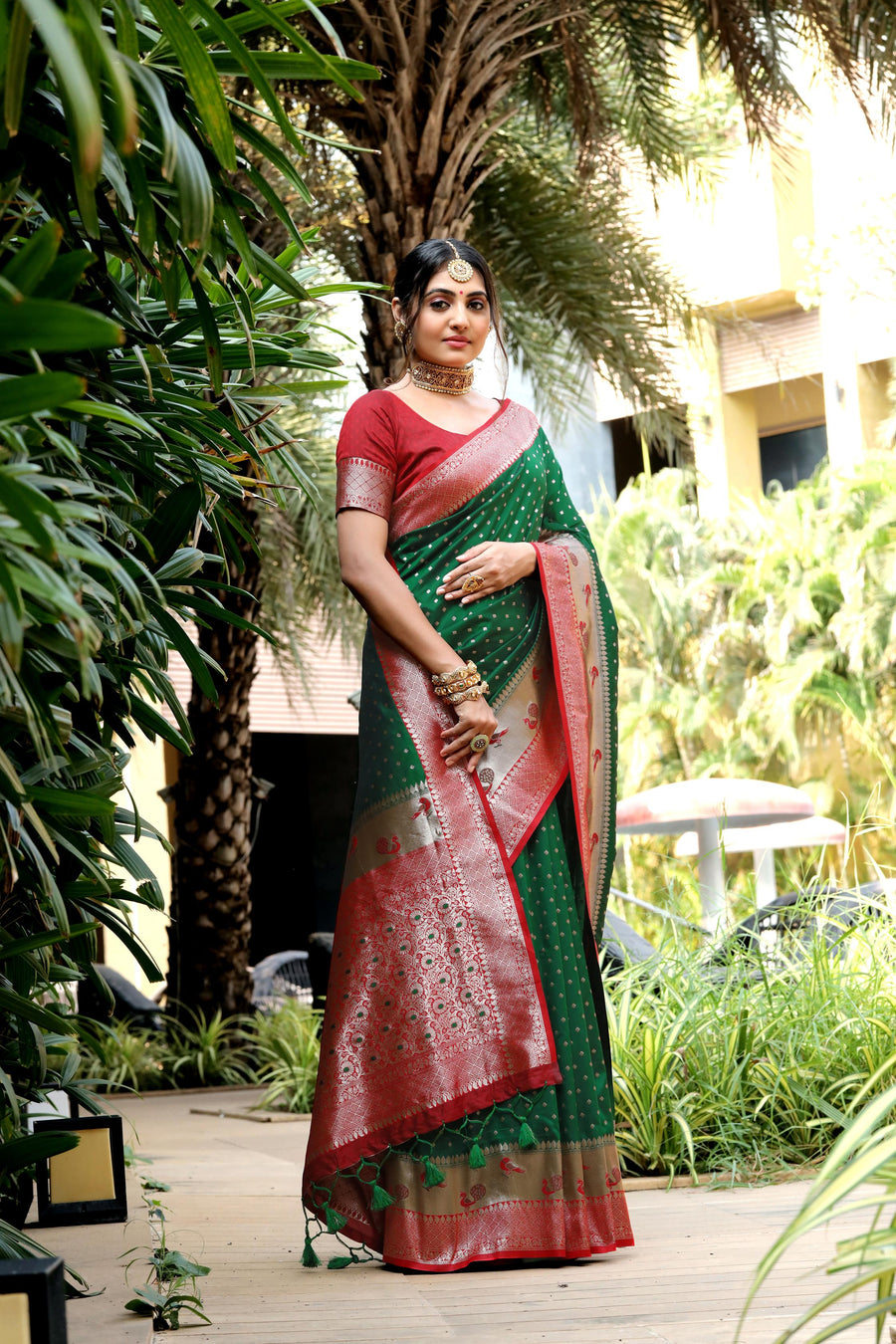 Elegant Green Banarasi soft silk saree with peacock border, zari pallu, and a matching blouse piece. Perfect for Indian weddings and special occasions.