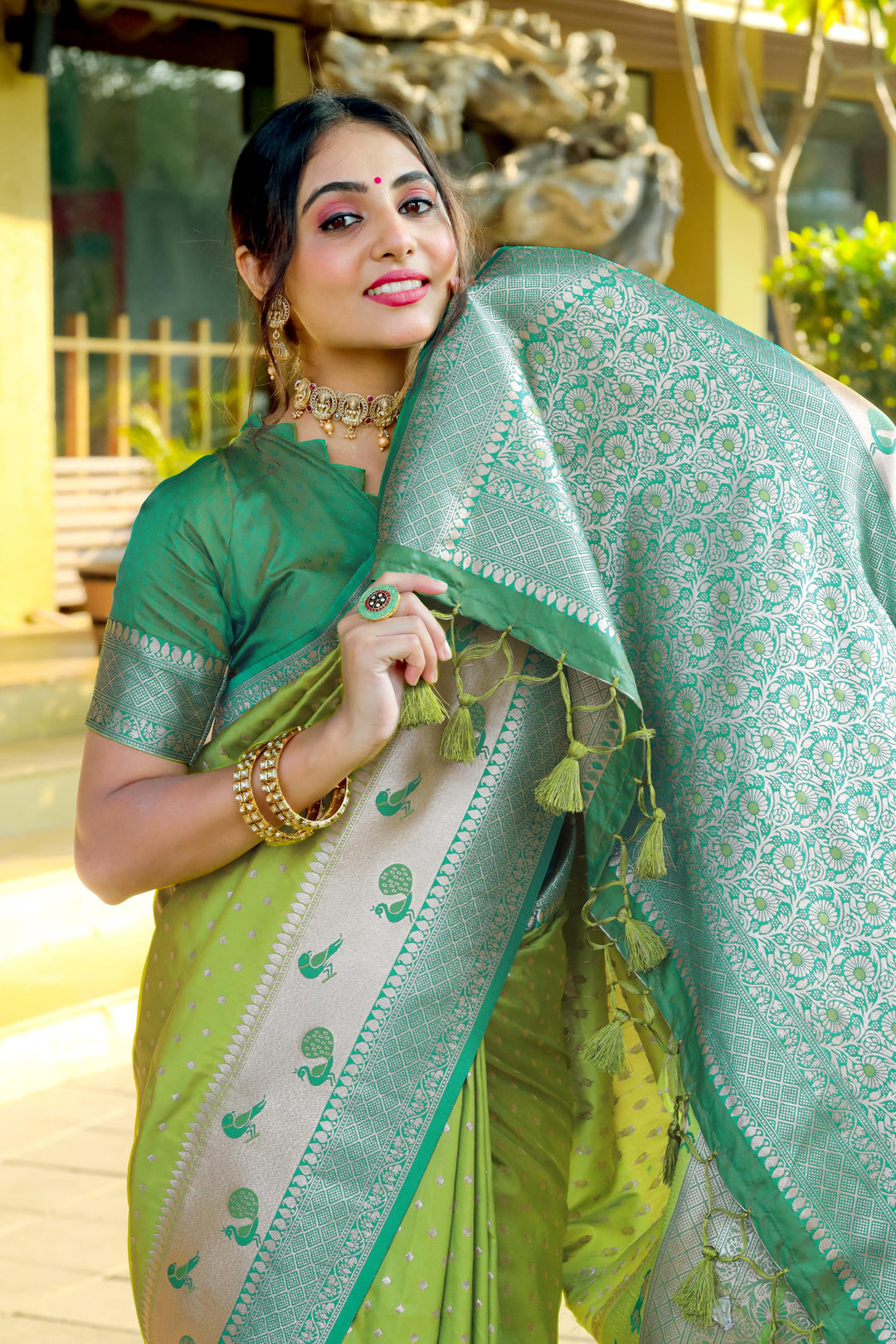 Olive Indian wedding saree with a Banarasi finish, peacock border, and exclusive zari pallu. A perfect blend of tradition and elegance.