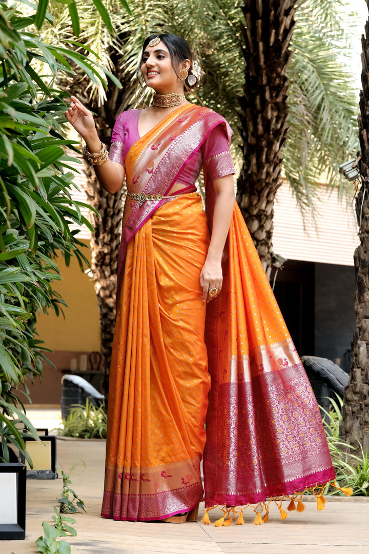 Fancy Orange saree with peacock border, zari pallu, and a contrast blouse piece. Perfect for festive celebrations or traditional Indian weddings.