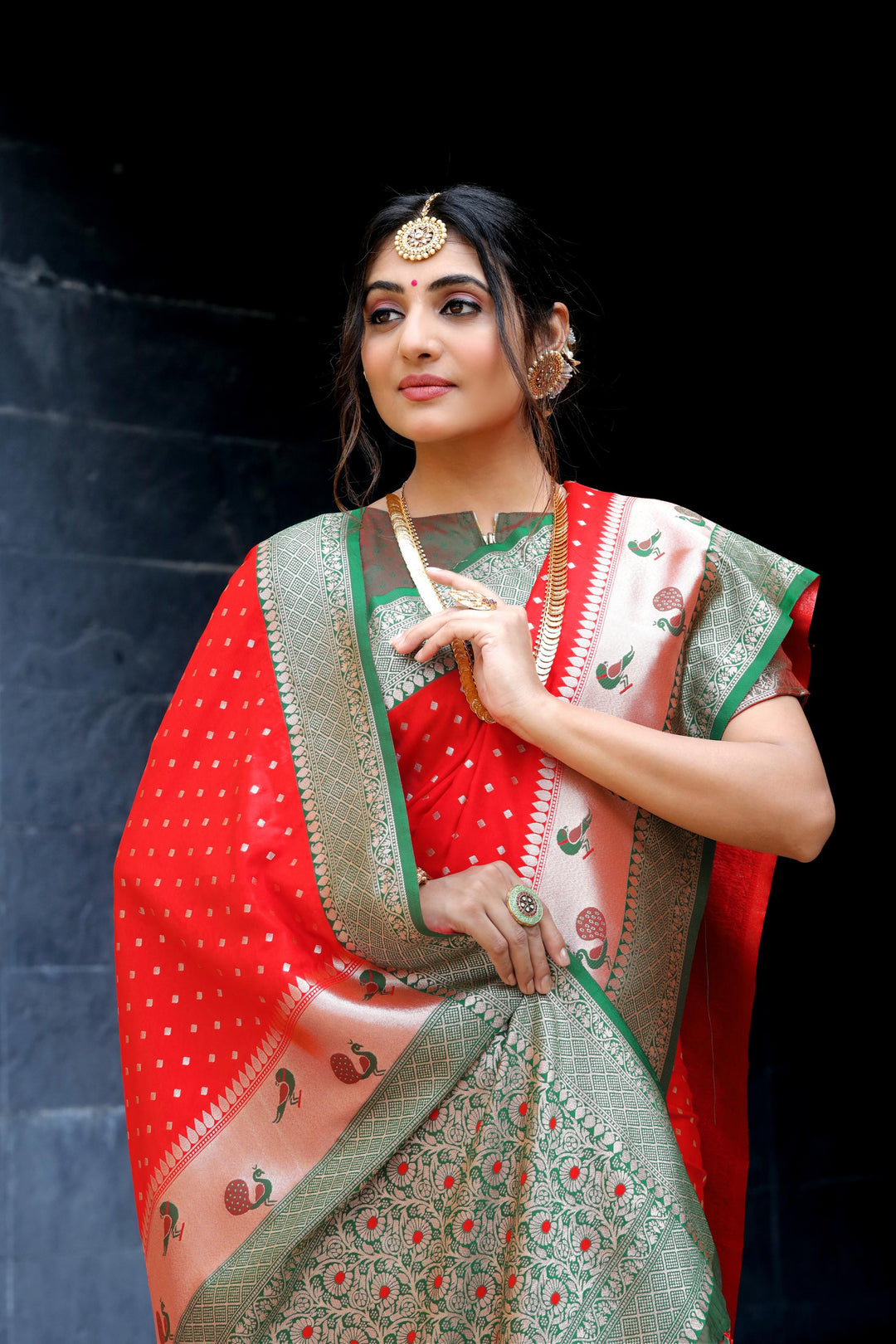 Luxurious Red saree with Banarasi, contrast peacock border, and intricate zari pallu. Perfect for Indian weddings and celebrations.