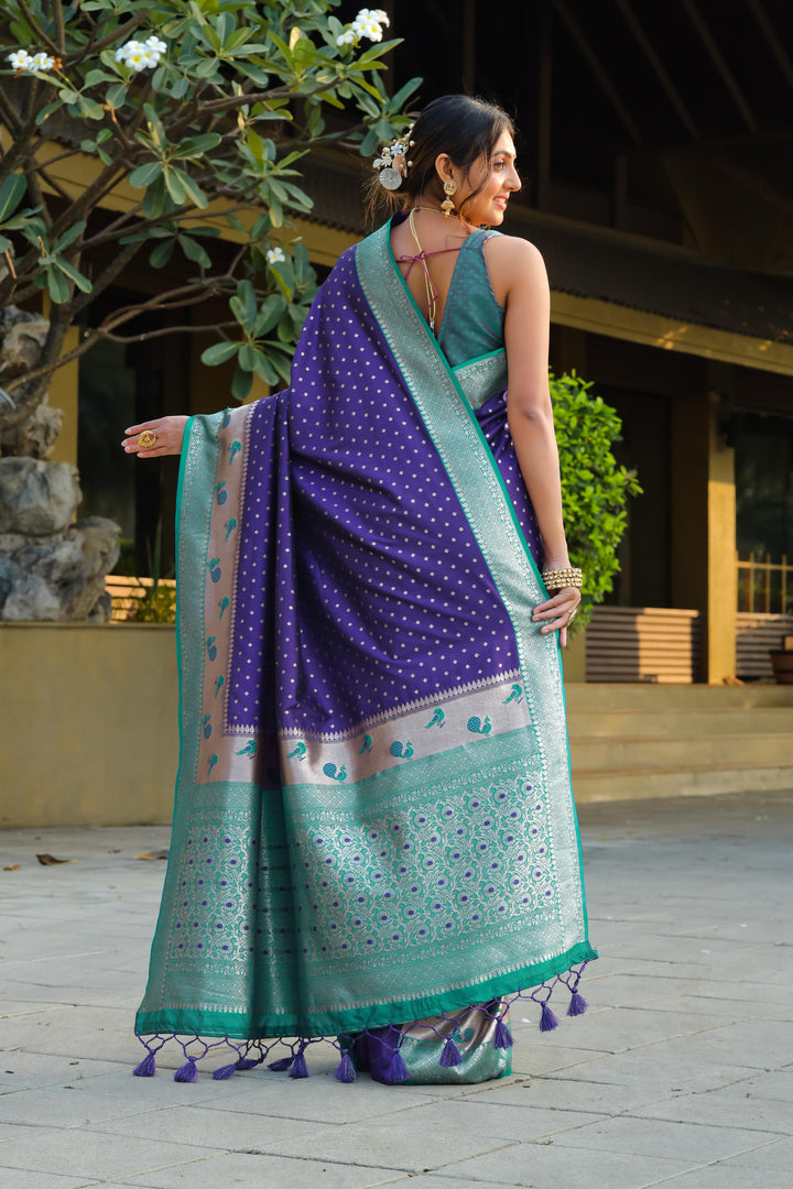 Beautiful Blue Indian sari with peacock border and exclusive zari pallu. Includes fancy tassels and blouse piece, perfect for weddings.