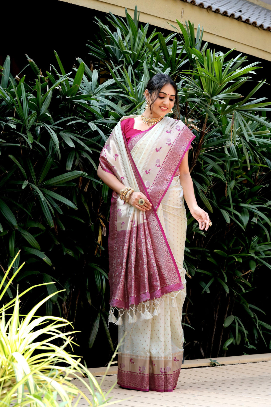 White fancy sarees with peacock border, zari pallu, and contrast blouse piece. Ideal for weddings, festivals, and other traditional events.