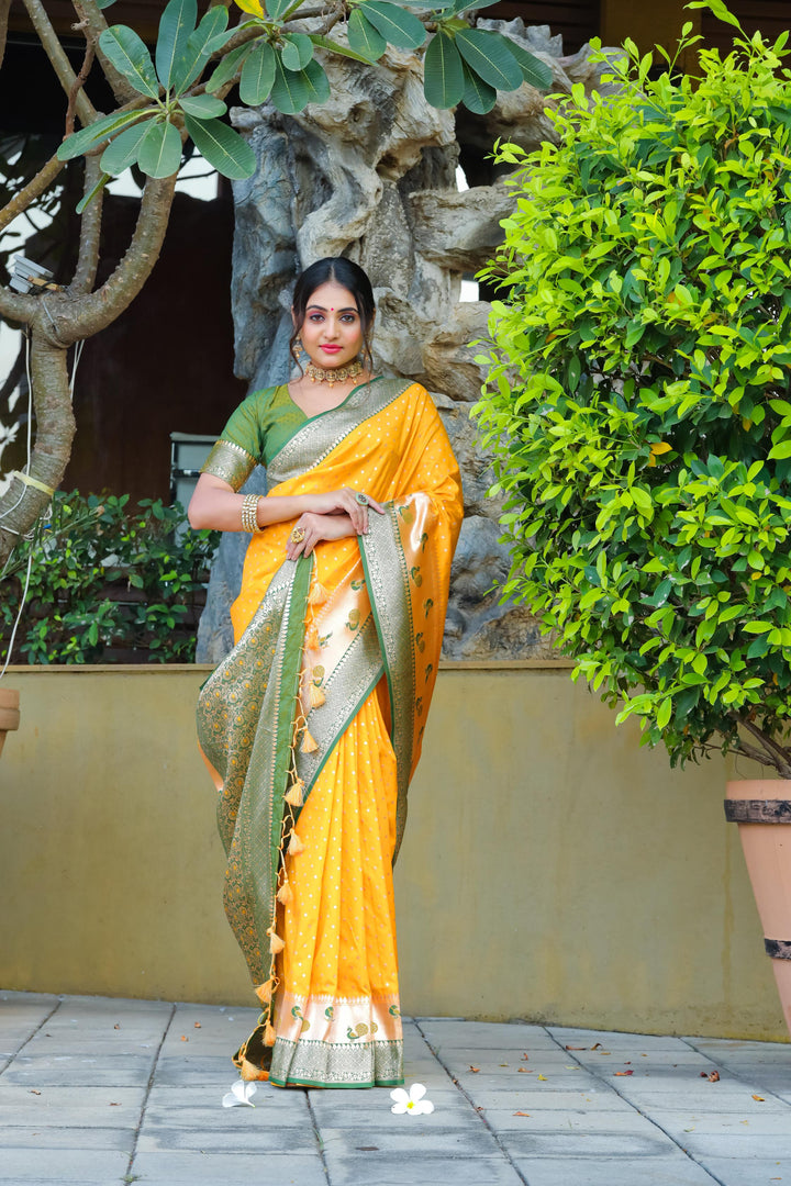 Gorgeous Yellow Indian wedding saree with peacock border, zari pallu, and contrast blouse piece. Ideal for special occasions and celebrations.