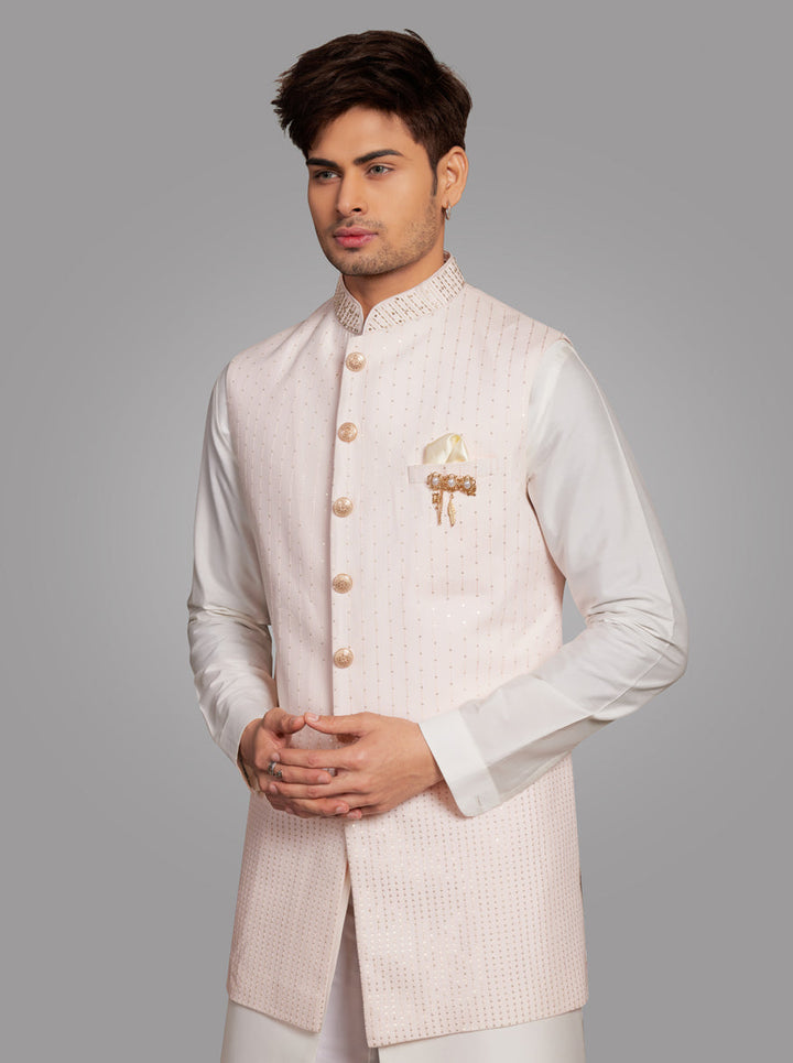 Luxurious light pink kurta set, ideal for special occasions, crafted from silk blend with exquisite embroidery.