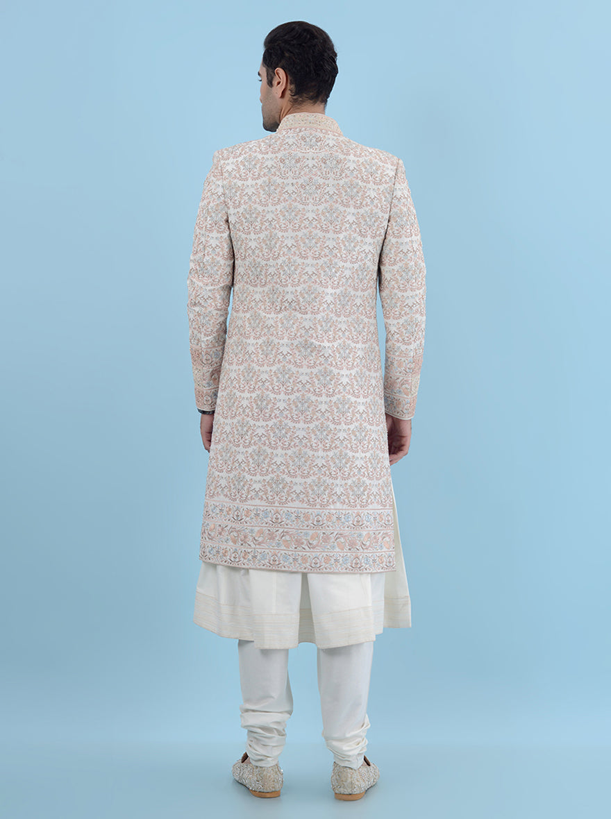 This Cream Multi Sherwani is designed for unforgettable moments, featuring luxurious silk and intricate embroidery, making it a stylish choice for modern grooms celebrating in the USA.