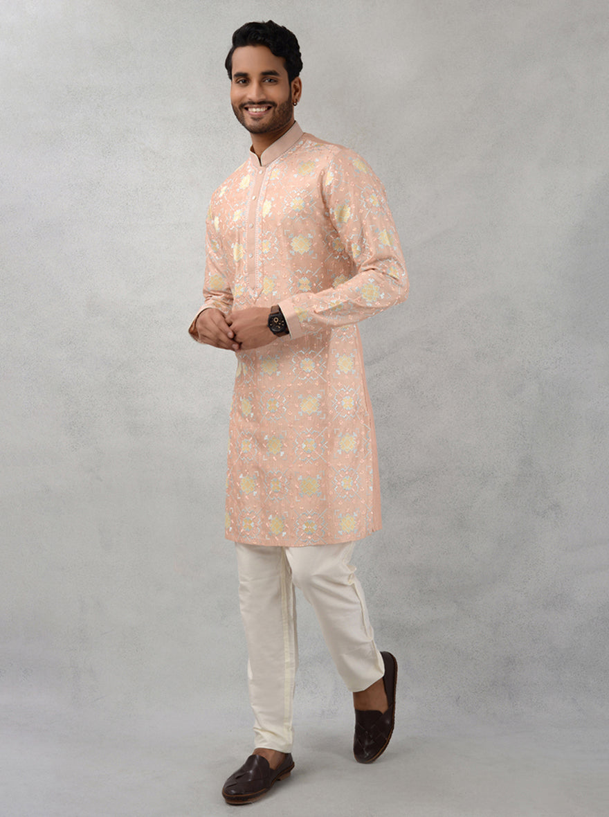 Discover elegance with our silk embroidered peach kurta pajama, ideal for special events and celebrations in the USA.