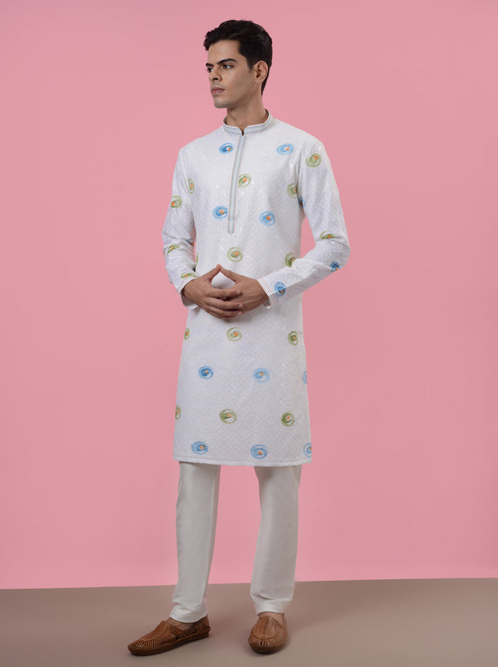 White silk kurta pajama for men, ideal for making an impression at traditional gatherings.