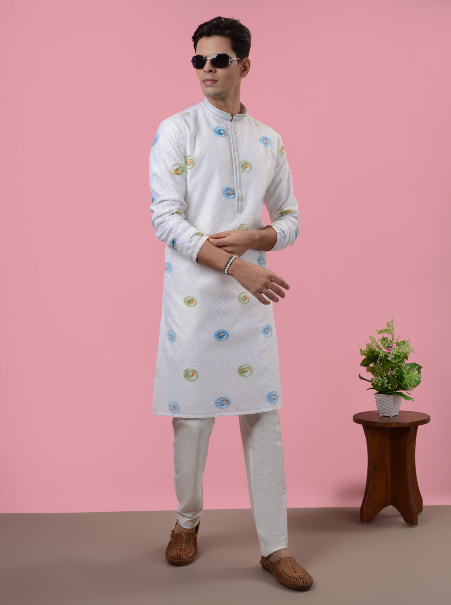 Intricately embroidered white silk kurta for men, combining style, elegance, and comfort.