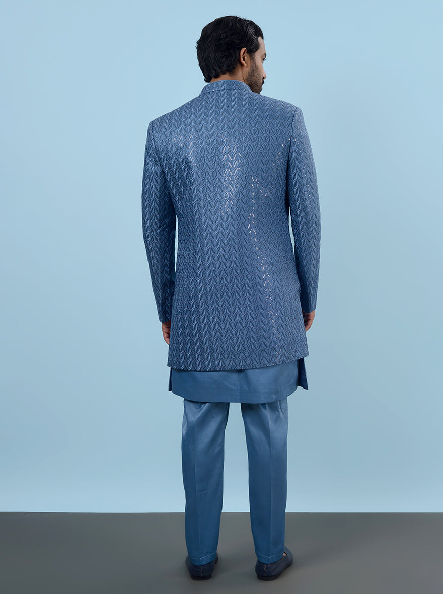 Elevate your look at sangeet parties in the USA with this trendy Blue Indowestern, crafted from soft silk blend and showcasing intricate embroidery for a sophisticated appeal.