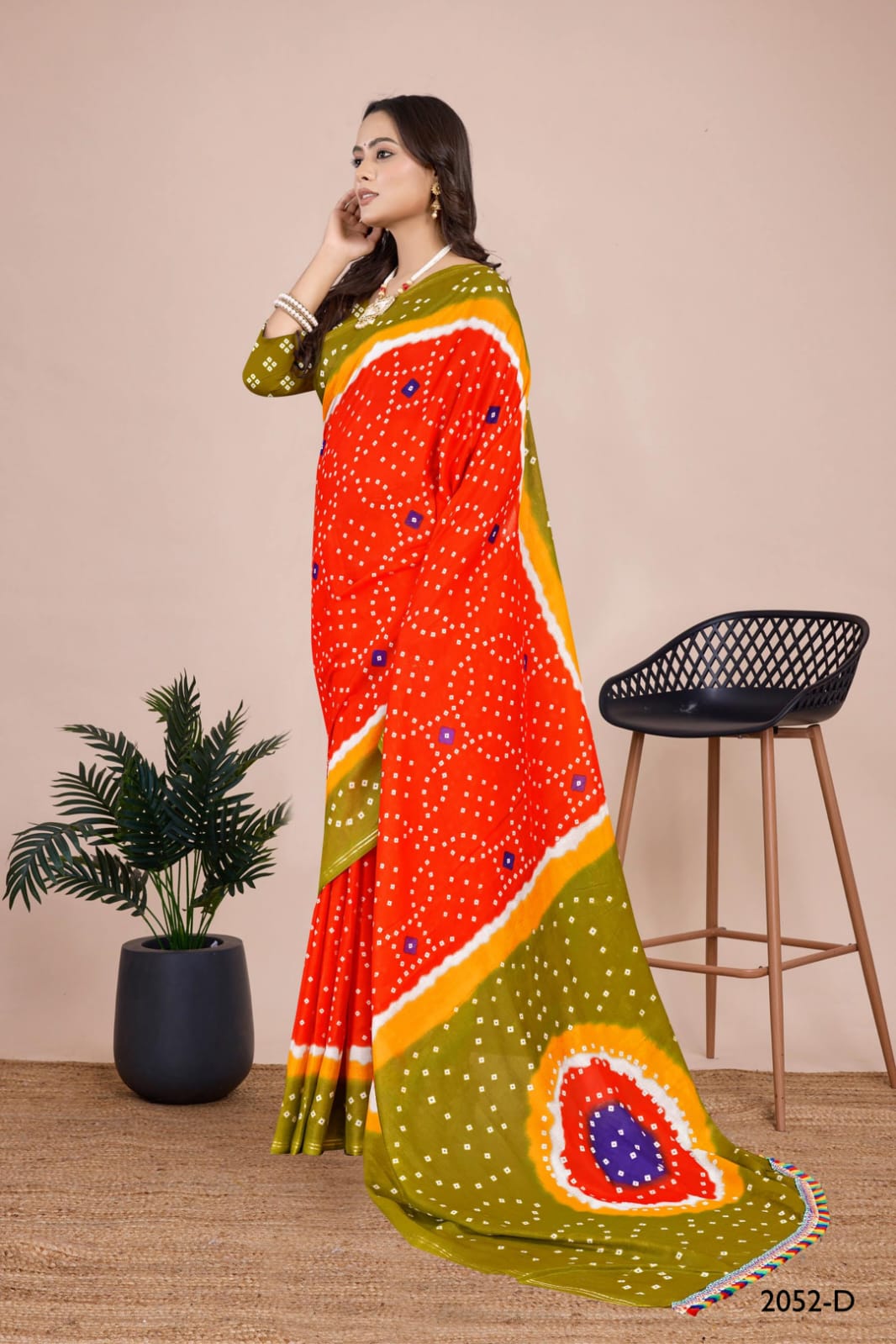 Chic yellow Bandhani saree with hand-tied patterns, designed for cultural and bridal gatherings in the USA.