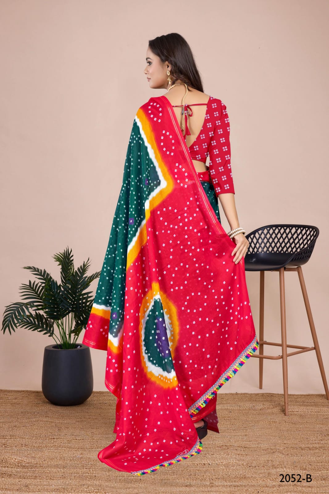 Vibrant rama handcrafted Bandhani saree with exquisite tie-dye patterns, perfect for Indian weddings and festive events.