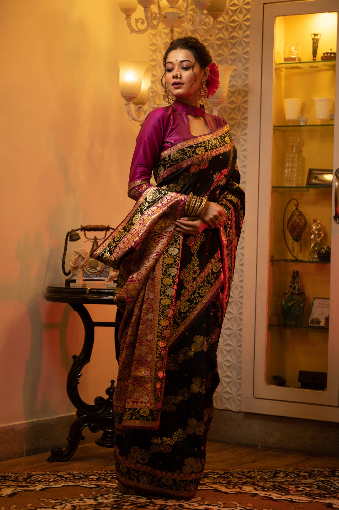 Elegant Banarasi saree with intricate Meena patterns and fancy tassels