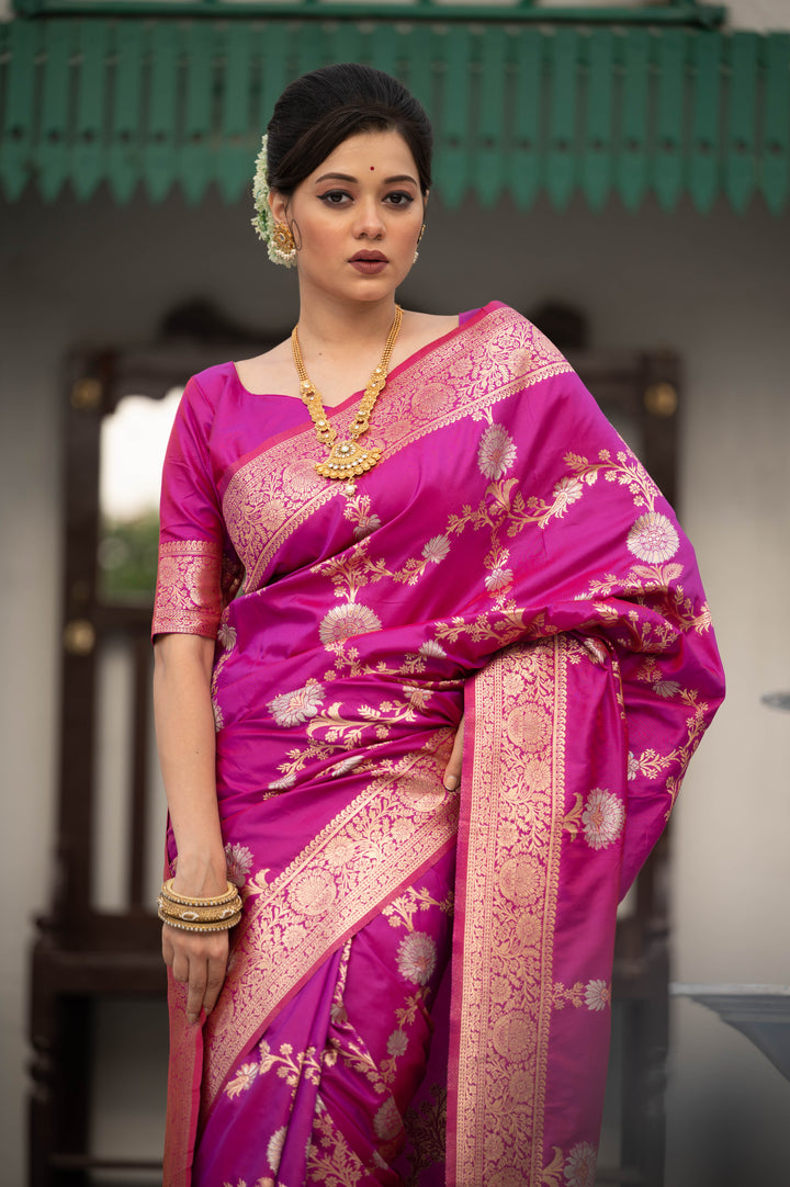 Radiant Soft Banarasi Katan silk saree with silver and gold zari weaves and a decorative tassel border.