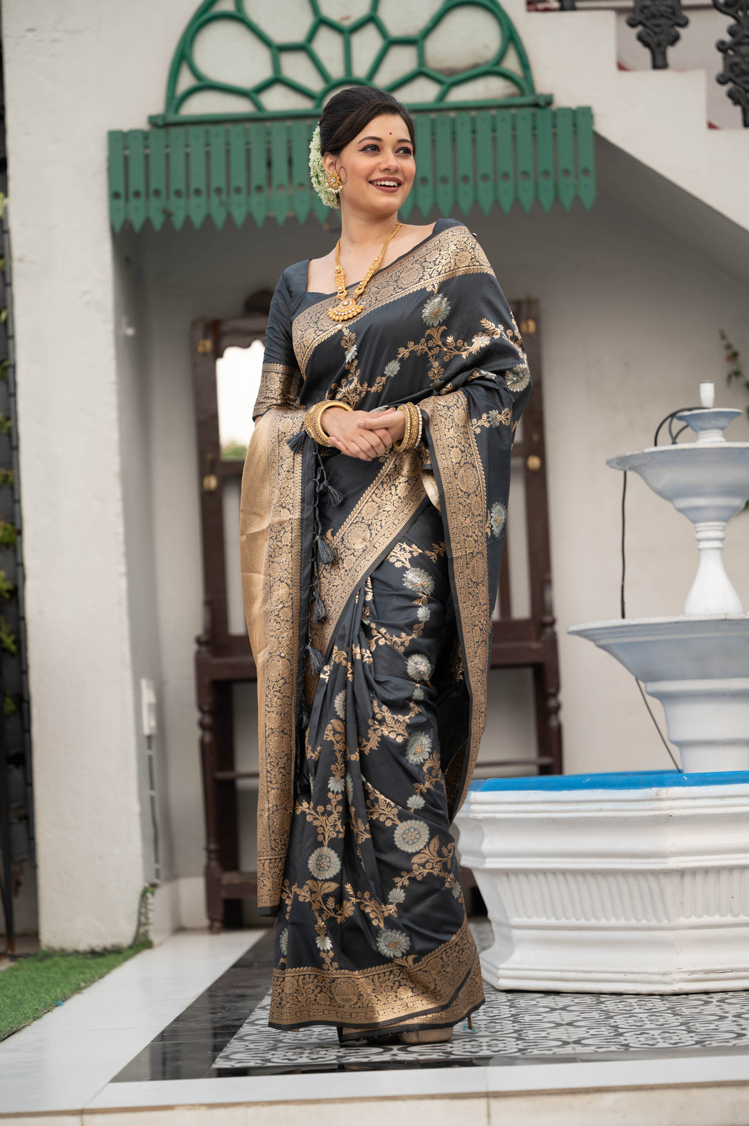 Soft Banarasi Katan silk saree with intricate zari detailing and elegant tassel borders for weddings.