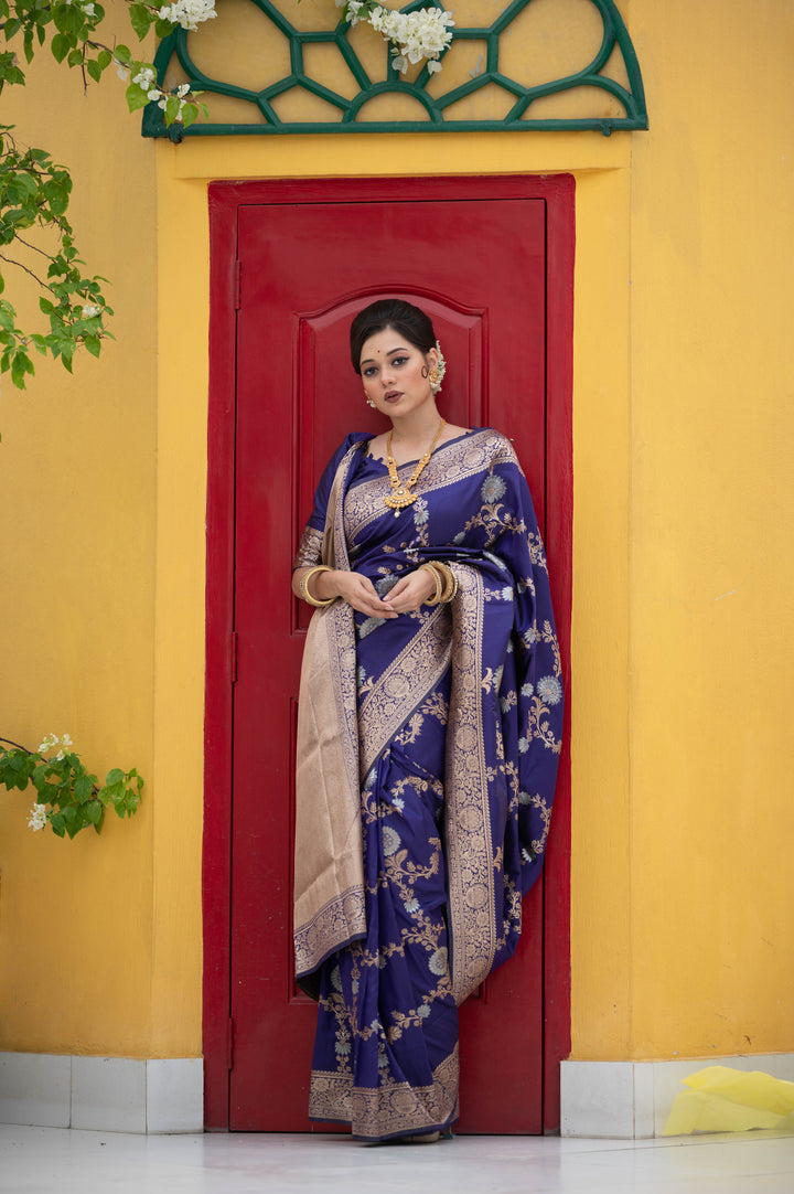 Elegant Soft Banarasi Katan silk saree with intricate silver and gold zari weaves and tassel accents.