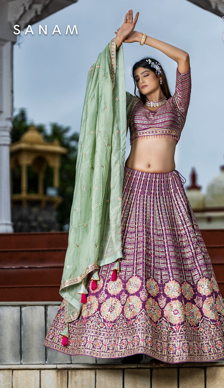 Gorgeous silk purple designer lehenga choli, perfect for brides looking for stunning attire on their special day.