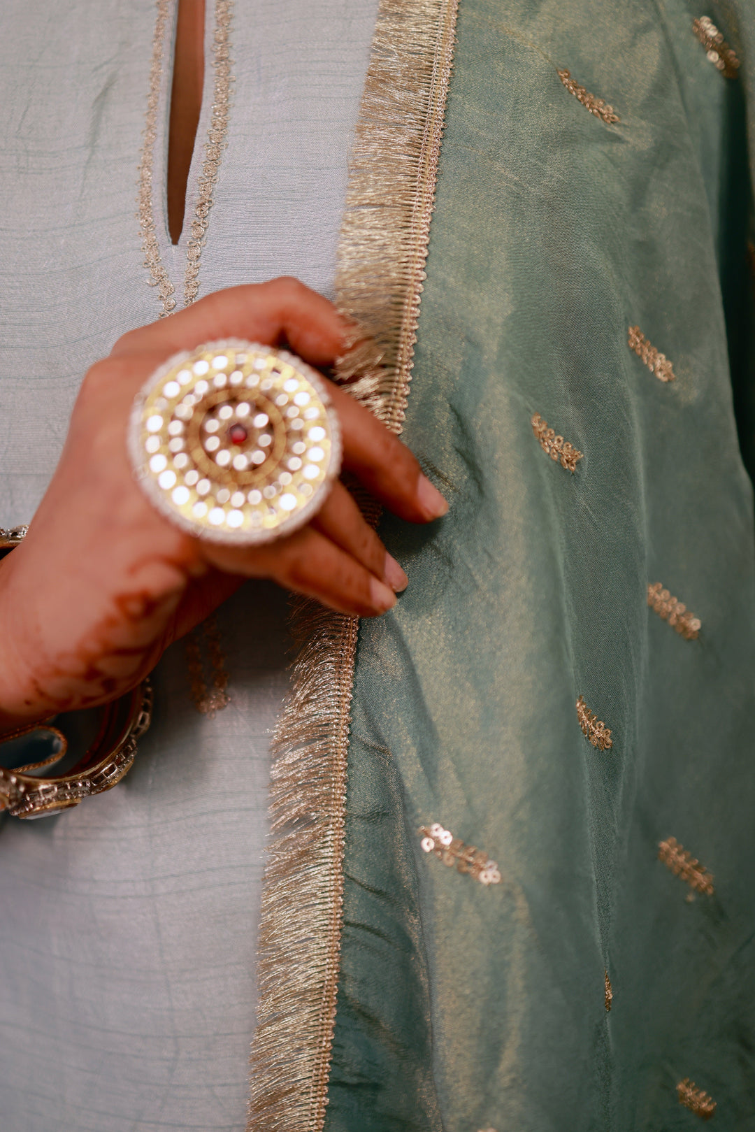 Beautiful ice blue kurta pajama set featuring a luxurious sage green dupatta, offering a stylish and sophisticated look.