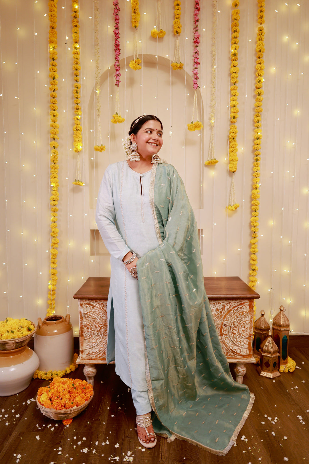 Elegant ice blue kurta pajama set paired with a stylish sage green dupatta, perfect for festive and formal occasions.