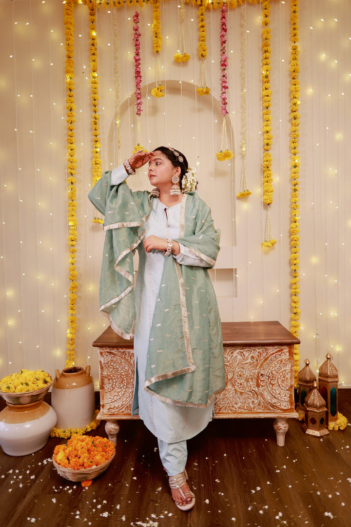 Elegant ice blue kurta pajama with a flowy sage green dupatta, crafted for a chic and graceful appearance at events.