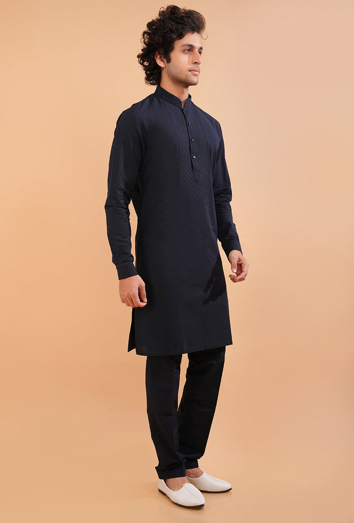 Navy blue cotton blend kurta pajama set with intricate embroidery, perfect for ethnic wear.