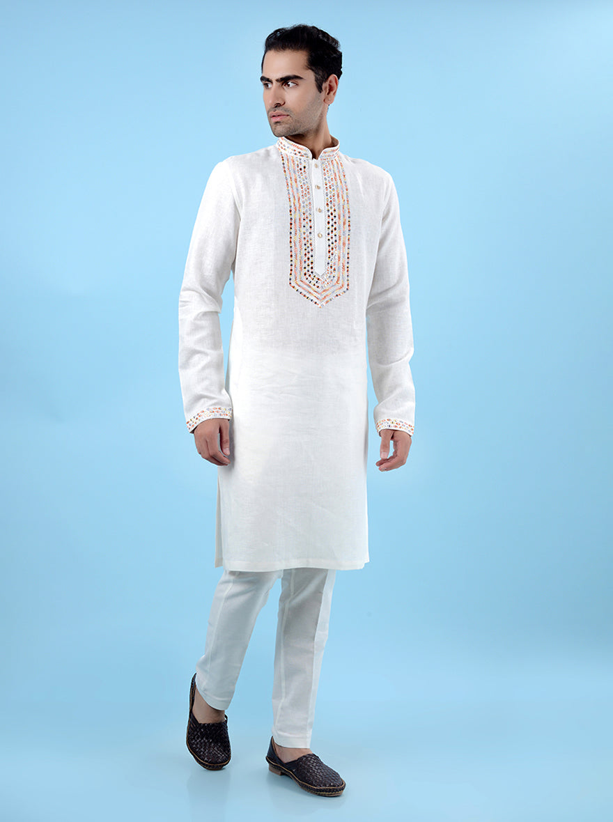 Off-white kurta pajama set for men, designed with embroidery for a perfect look for traditional celebrations.