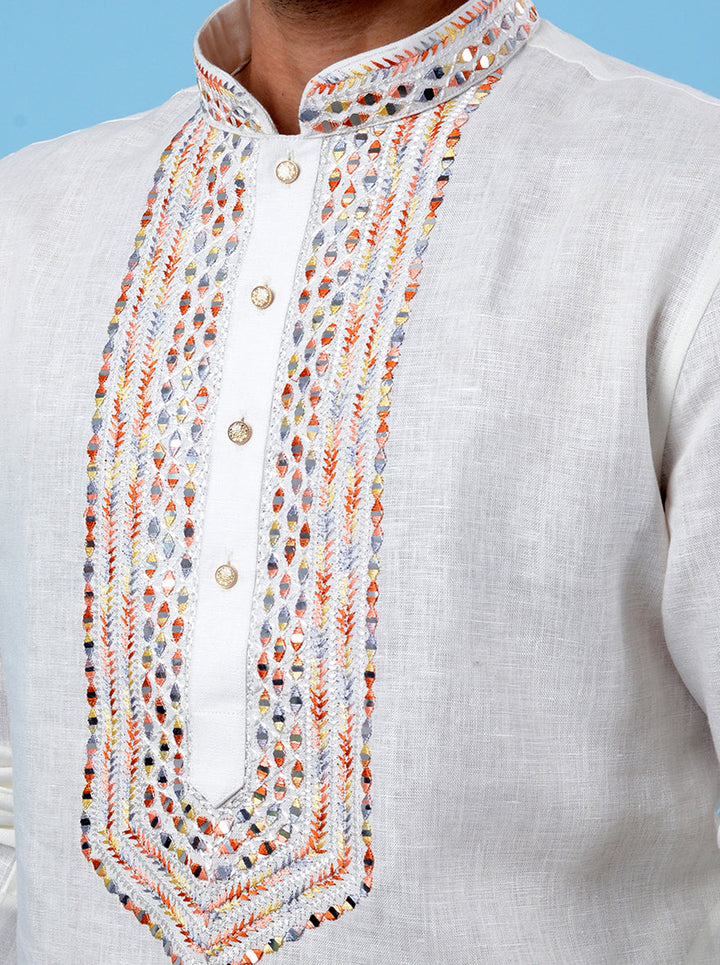 Traditional off-white kurta pajama set for men, crafted with fine embroidery for a luxurious look.