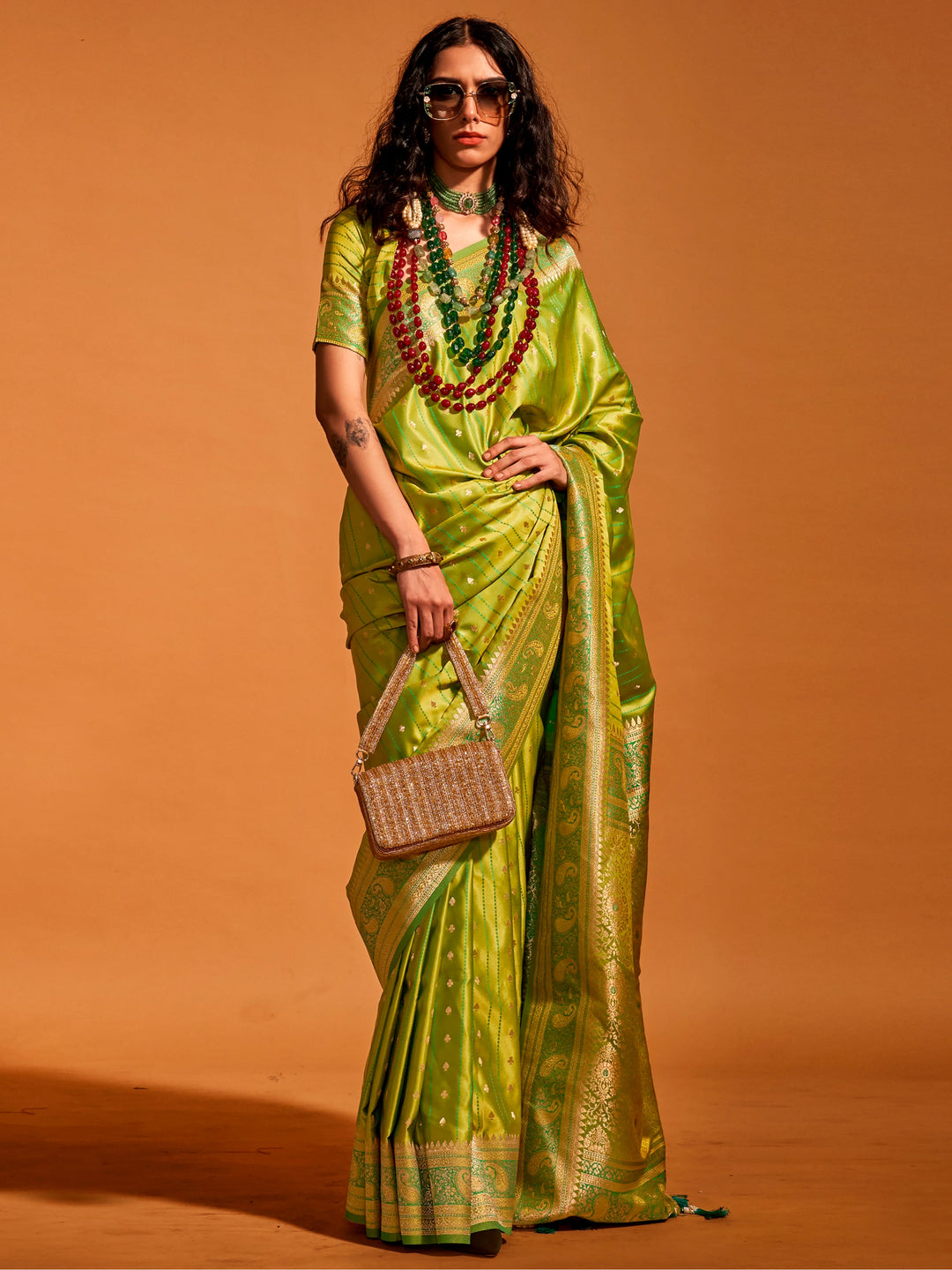 Green satin saree crafted for elegance and style.