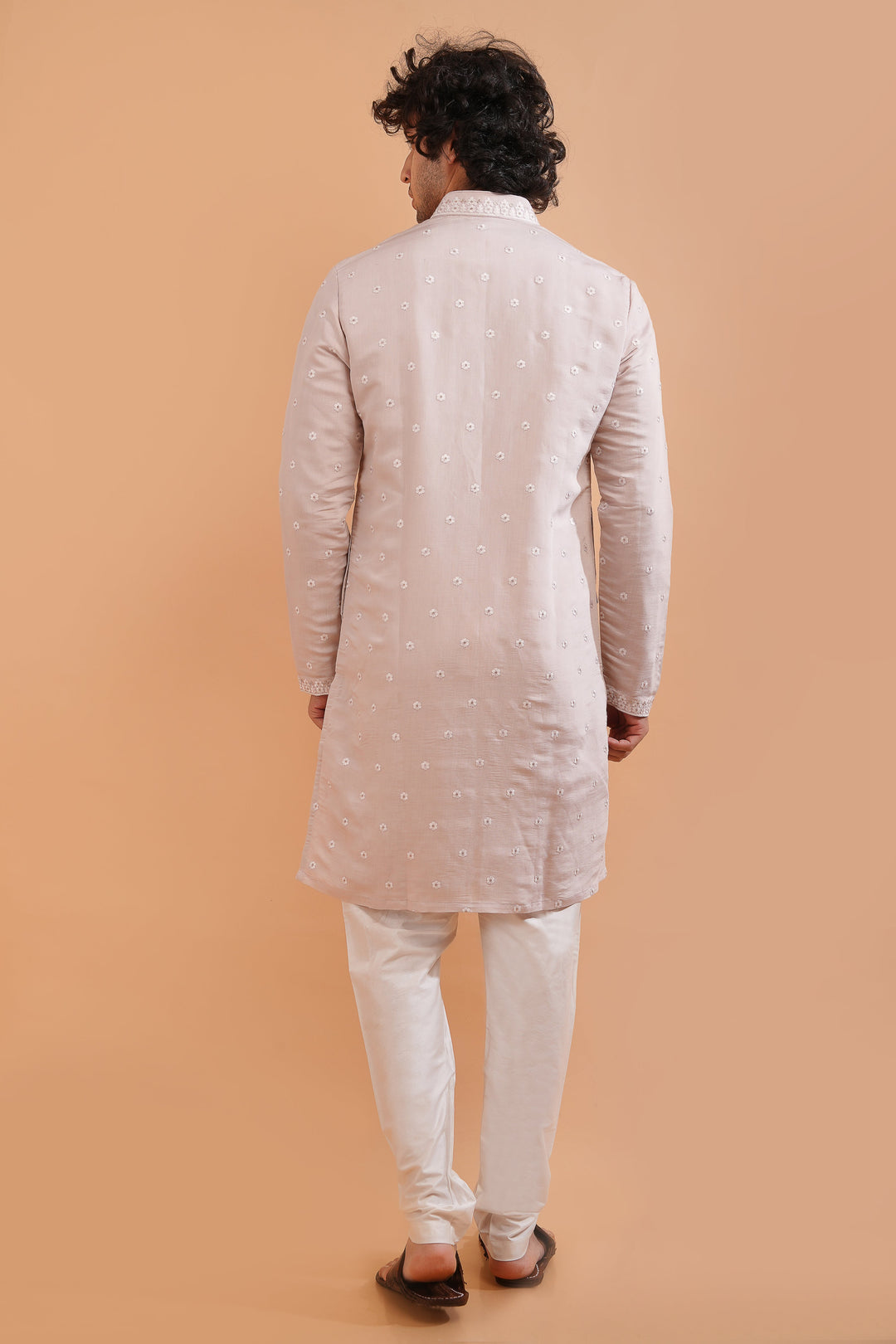 Shine at festive events in the USA with this pale pink embroidered kurta pajama set for men.