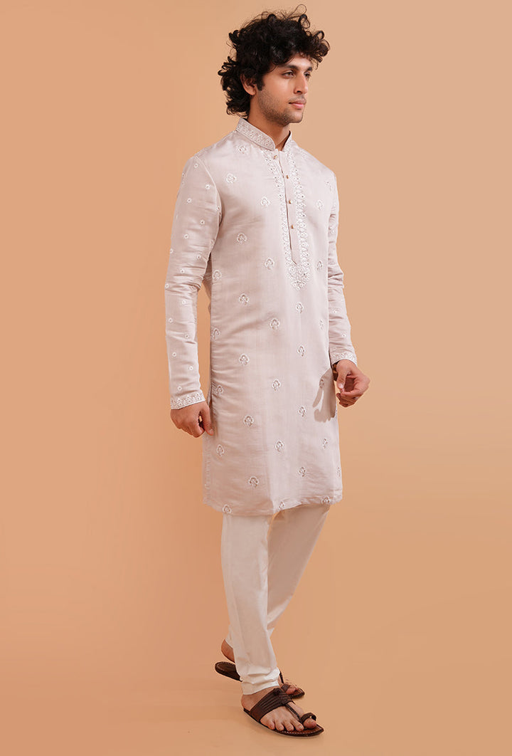 Experience luxury with this elegant pale pink kurta pajama, crafted for stylish gatherings in the USA.