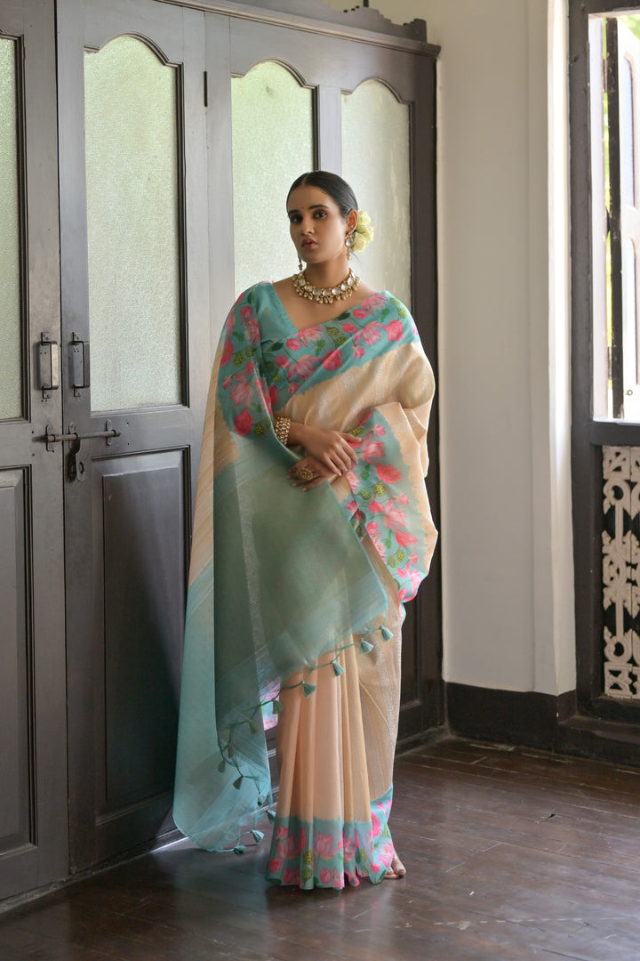 Stunning sky-blue soft silk saree with Pichwai lotus print and rich zari pallu, perfect for cultural celebrations.