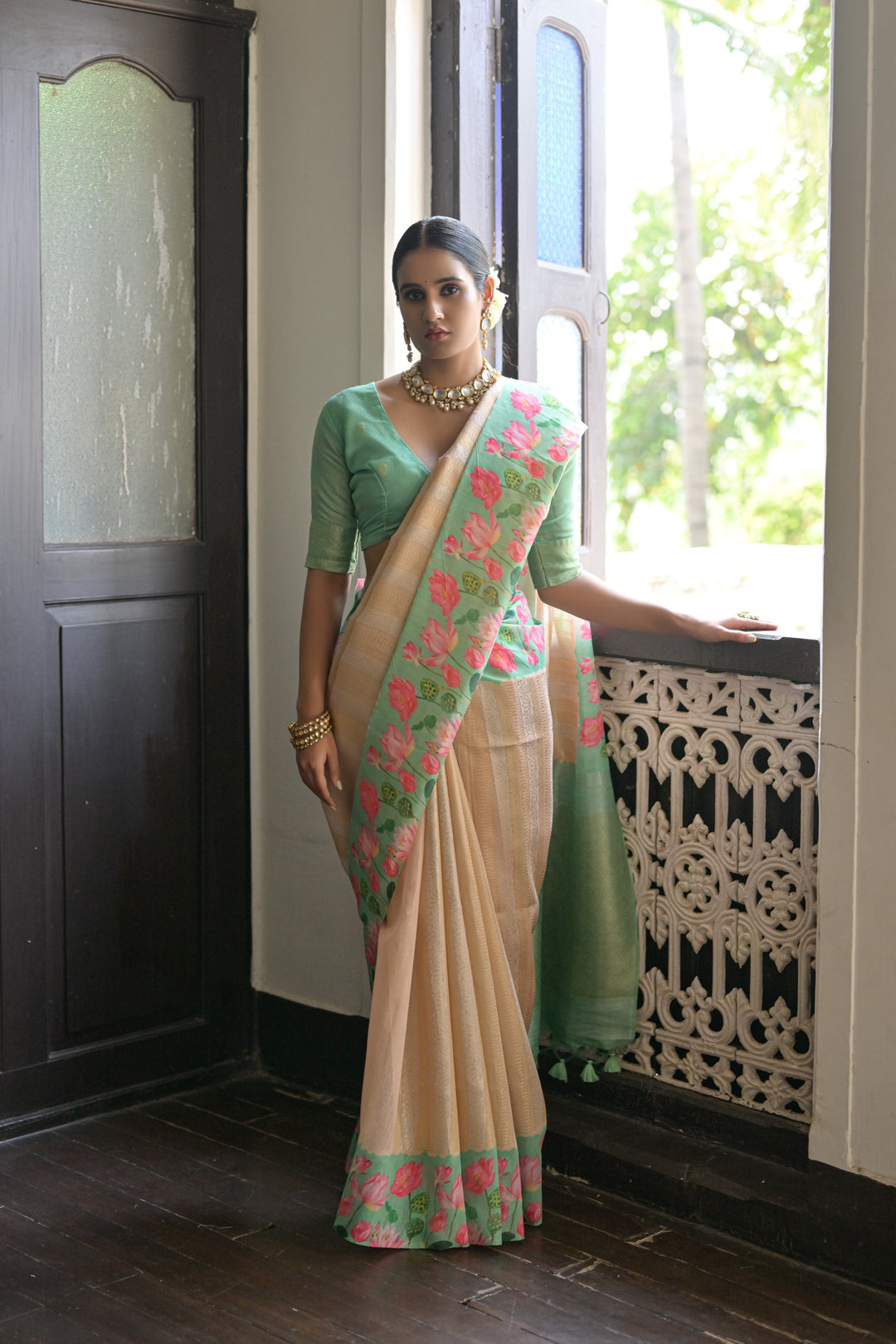 Gorgeous sky-blue soft silk saree featuring Pichwai lotus print and exquisite zari pallu, perfect for weddings.