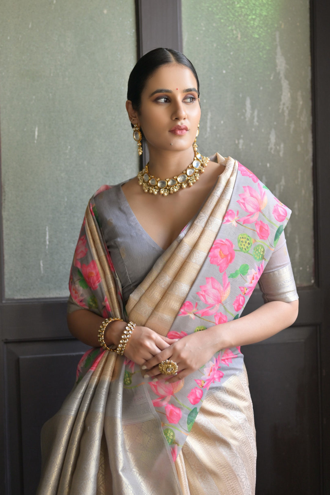 Beautiful light-green soft silk saree featuring Pichwai lotus print and rich zari pallu, perfect for cultural celebrations.