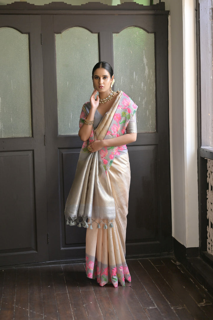 Stunning light-green soft silk saree with intricate Pichwai lotus print and exquisite zari pallu, ideal for weddings.