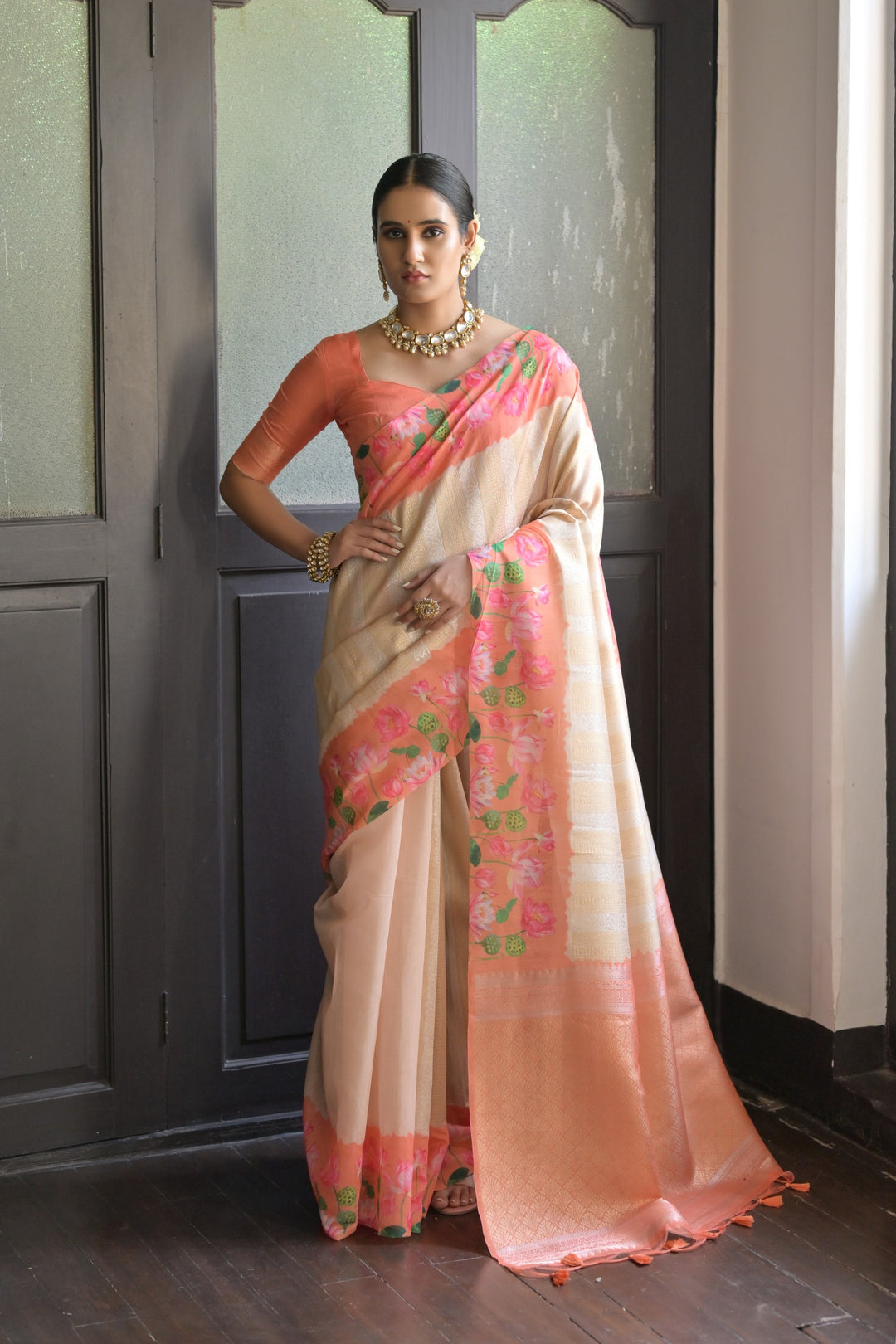 Gorgeous light-green soft silk saree with Pichwai lotus print and delicate zari pallu, perfect for traditional wear.