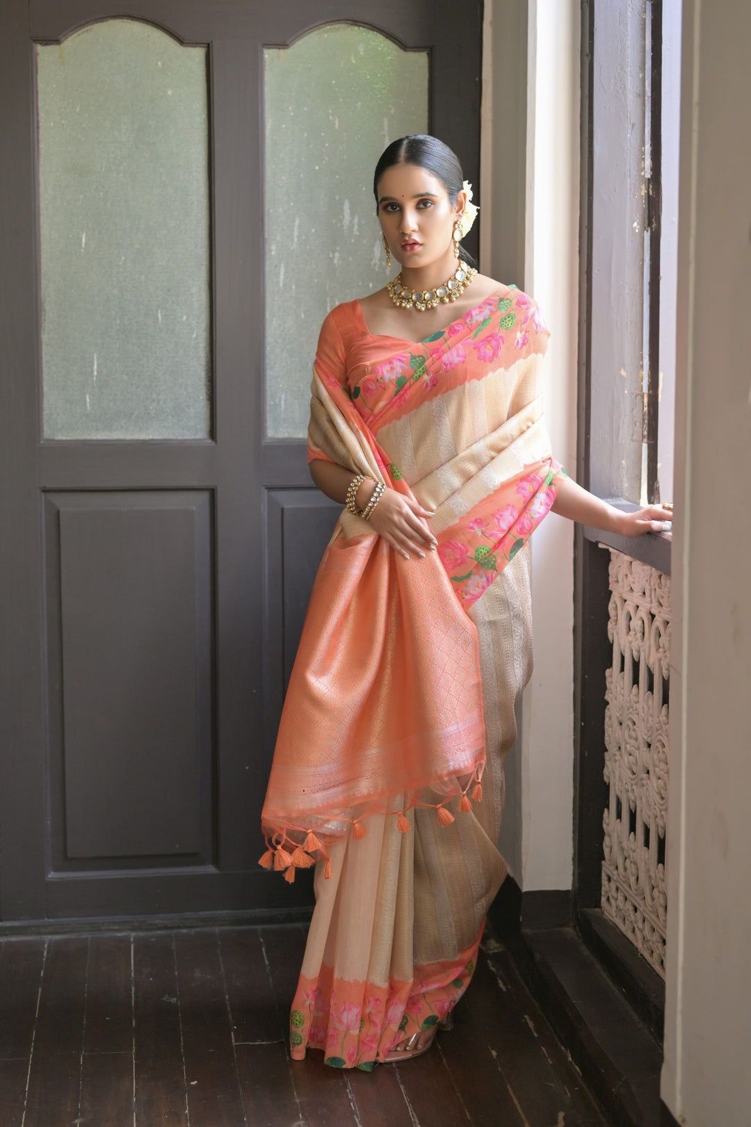 Sophisticated gray soft silk saree with Pichwai lotus print and elegant zari pallu, perfect for formal events.