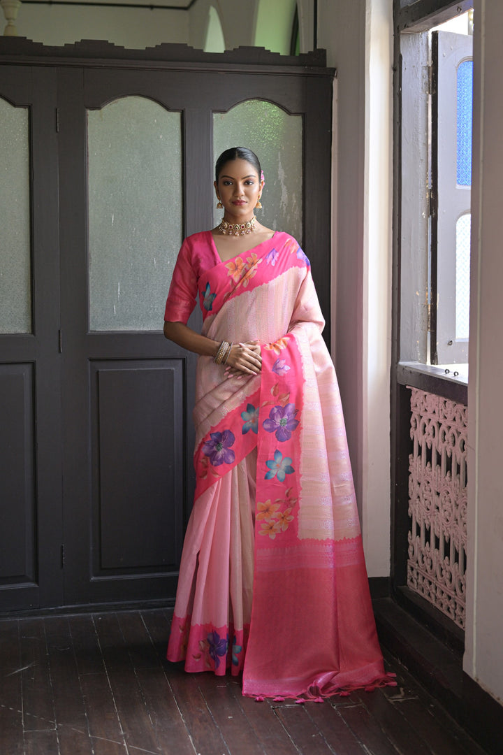 Stunning orange silk saree featuring flower prints and an intricate lotus pattern pallu, ideal for weddings and special occasions.