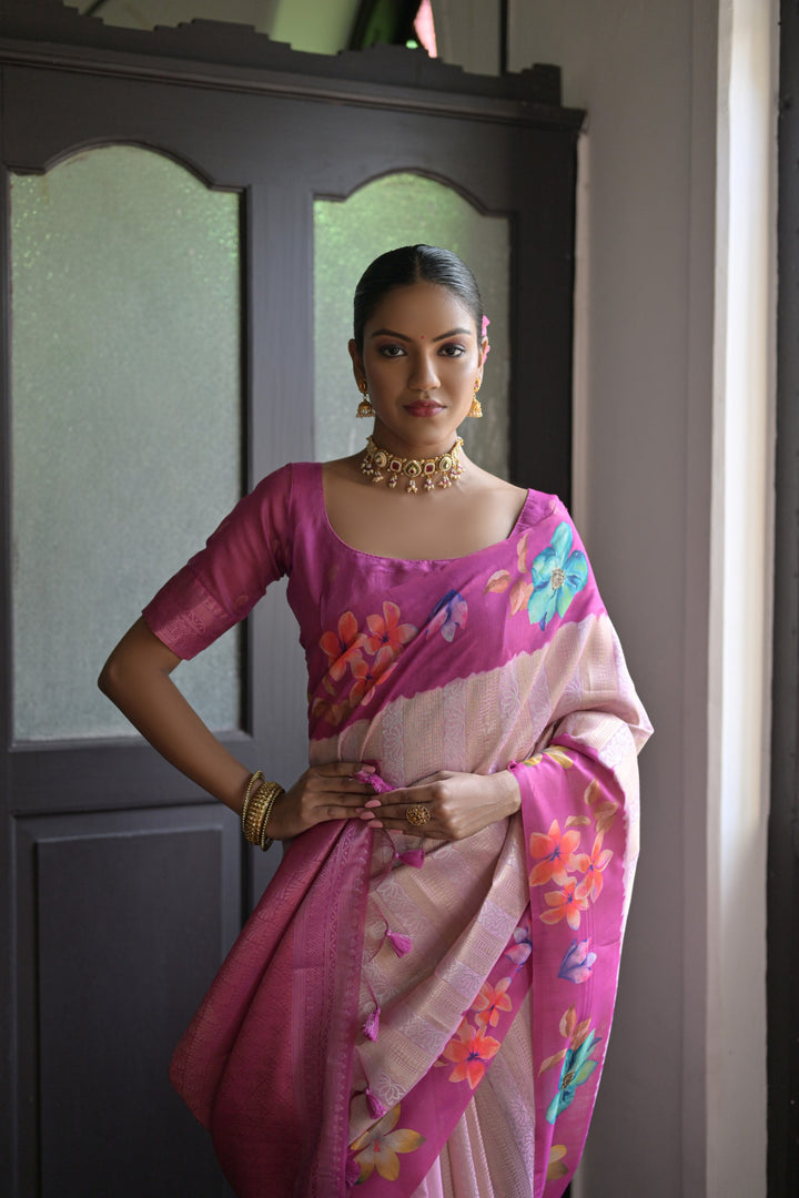 Graceful pink silk saree with beautiful floral prints and a fancy lotus pallu, ideal for weddings and special occasions.