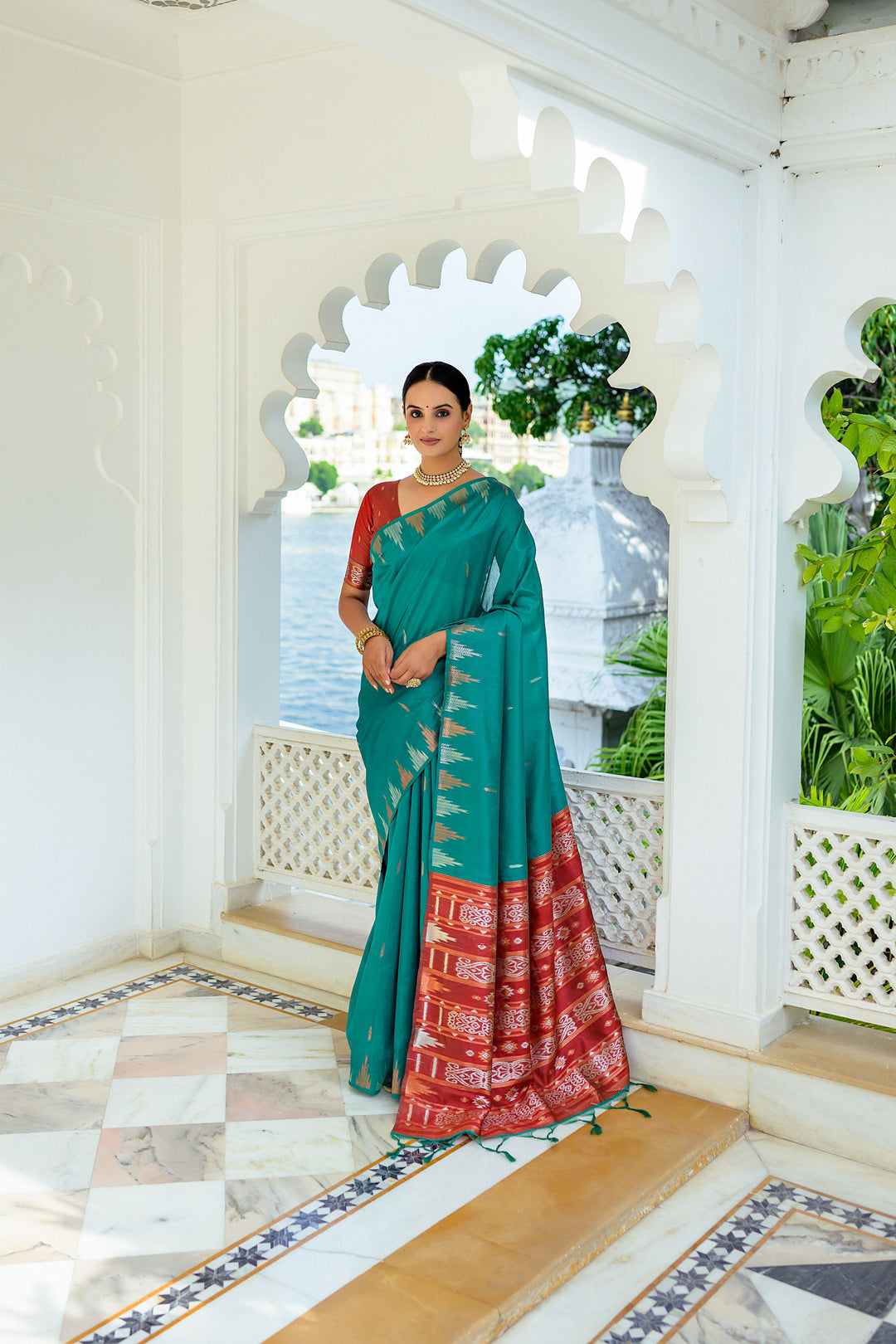 Gorgeous pink Tussar silk saree with intricate temple border and Ikkat pallu details, ideal for evening functions.