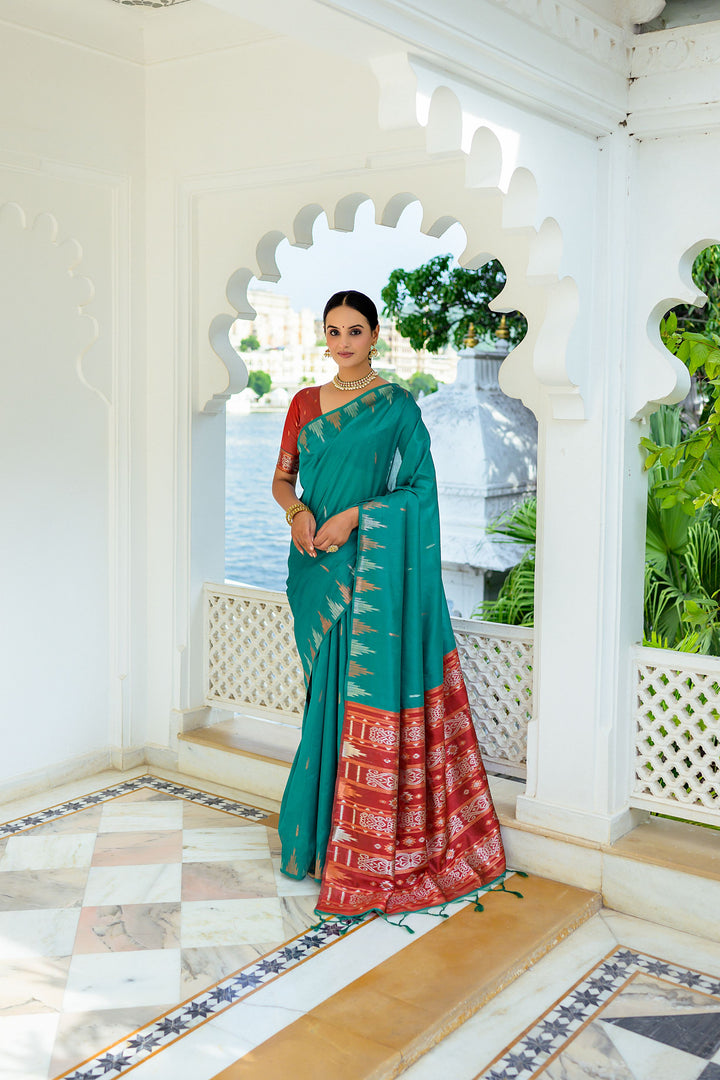 Gorgeous pink Tussar silk saree with intricate temple border and Ikkat pallu details, ideal for evening functions.