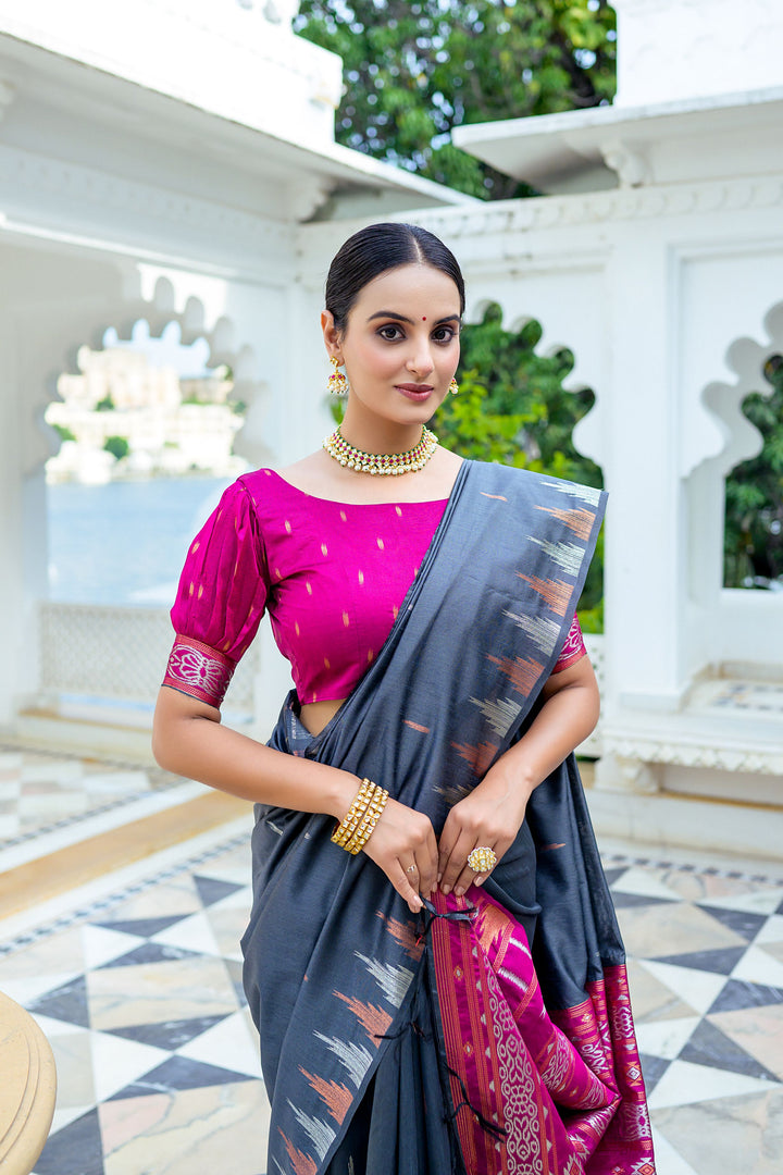 Stunning red Tussar silk saree with a unique temple border and fancy Ikkat pallu, perfect for special occasions.