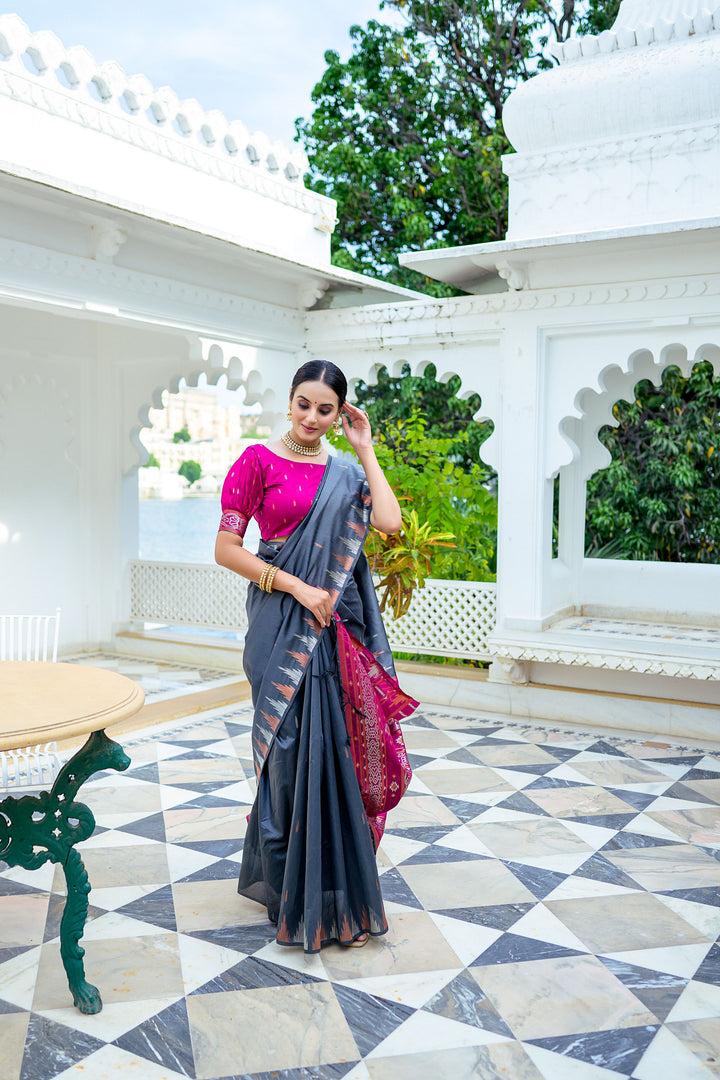 Timeless blue Tussar silk saree with intricate temple border and a vibrant Ikkat pallu, perfect for weddings.