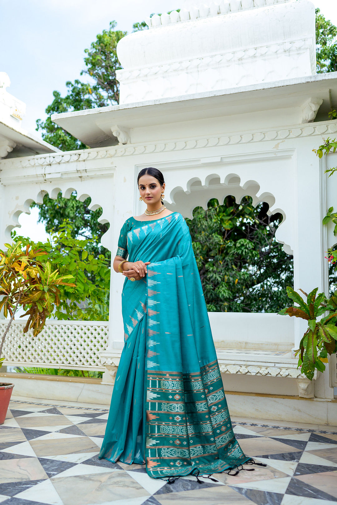 Elegant blue Tussar silk saree featuring a unique temple border and colorful Ikkat pallu design, perfect for cultural events.