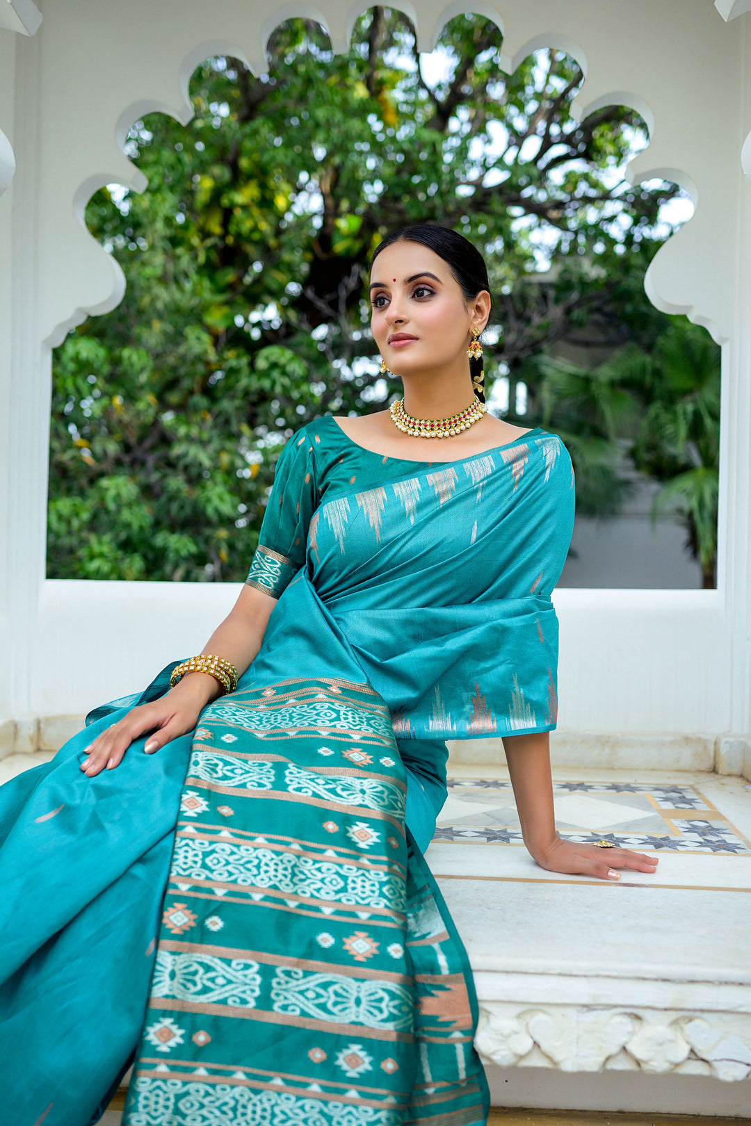 Elegant grey Tussar silk saree with a unique temple border and stylish Ikkat pallu design, perfect for upscale events.