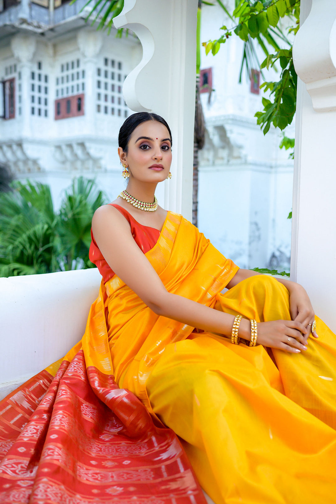 Stunning sea-blue Tussar silk saree with a unique temple border and colorful Ikkat pallu, perfect for cultural celebrations.