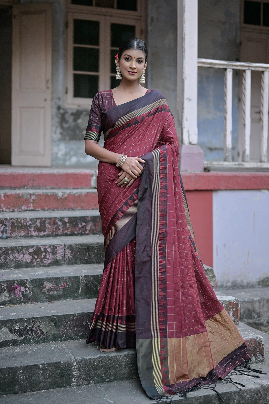 Timeless raw silk saree with temple woven border and zari pallu for festive occasions